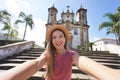 Beautiful tourist woman takes self portrait in the baroque colonial city of Ouro Preto, old capital of the state Minas Gerais, Royalty Free Stock Photo