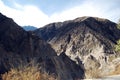 Beautiful towering mountains under the blue sky and white clouds Royalty Free Stock Photo