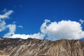 Beautiful towering mountains under the blue sky and white clouds Royalty Free Stock Photo