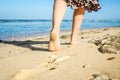 Beautiful traces with feet on sea nature background