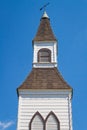 Beautiful traditional church in rural. Exterior of a Little White Country Church on a Sunny Day and blue sky background Royalty Free Stock Photo