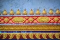 Beautiful traditional golden Thai style stucco patterned for decorative on wall background at Buddhist temple in Thailand. Royalty Free Stock Photo