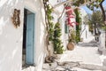 Beautiful traditional greek street with flowers in Amorgos island, Greece Royalty Free Stock Photo