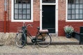 Beautiful traditional house in Haarlem with red brick and a bicycle parked in the front. Royalty Free Stock Photo