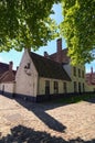 Beautiful traditional houses in the old town of Bruges dutch: Brugge, Belgium. Spring landscape photo Royalty Free Stock Photo