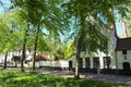 Beautiful traditional houses in the old town of Bruges dutch: Brugge, Belgium. Spring landscape photo Royalty Free Stock Photo