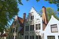 Beautiful traditional houses in the old town of Bruges dutch: Brugge, Belgium. Spring landscape photo Royalty Free Stock Photo