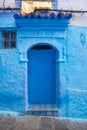 Traditional Moroccan door with canopy in Chefchaouen, the Blue Pearl Morocco Royalty Free Stock Photo