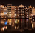 Beautiful traditional old buildings at night with reflection