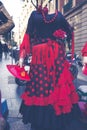 Beautiful traditional red flamenco dress hanged for display in a Royalty Free Stock Photo
