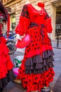 Beautiful traditional red flamenco dress hanged for display in a Royalty Free Stock Photo