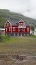 reflection in the water from a colorful house, Seydisfjordur, Iceland