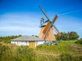 Beautiful and traditional thatched windmill in german north sea Royalty Free Stock Photo