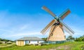 Beautiful and traditional thatched windmill in german north sea village Royalty Free Stock Photo