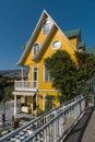 Beautiful traditional yellow wooden building in Valparaiso, Chile