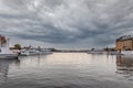 Beautiful tranquil winter city scene with water, ships  and dramatic sky in Stockholm Sweden. Royalty Free Stock Photo