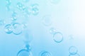 Beautiful Transparent Blue Soap Bubbles Floating in The Air. Abstract Blurred Background. Royalty Free Stock Photo
