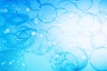 Beautiful Transparent Blue Soap Bubbles Floating in The Air. Blue Gradient Background, Refreshing of Soap Suds Bubbles Water. Royalty Free Stock Photo