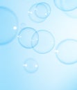 Beautiful Transparent Blue Soap Bubbles Floating in The Air. Blue Gradient Blurred Background Royalty Free Stock Photo