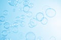 Beautiful Transparent Blue Soap Bubbles Floating in The Air. Blue Gradient Blurred Background Royalty Free Stock Photo