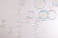 Beautiful transparent colorful blue and pink soap bubbles floating background.