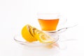 Beautiful transparent Cup with saucer with tea and lemon.