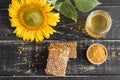 Beautiful transparent honey in bank, honeycombs and pollen on a wooden table Royalty Free Stock Photo