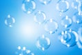 Beautiful Transparent Shiny Blue Soap Bubbles Floating in The Air. Refreshing of Soap Suds, Bubbles Water. Royalty Free Stock Photo