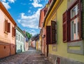 Beautiful Transylvanian street on a sunny summer day in Sighisoara, Romania.