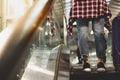 Beautiful traveler or departure woman use escalator for going to Royalty Free Stock Photo