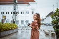 beautiful traveller with long brown hair pointing on the building Royalty Free Stock Photo