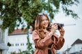 beautiful traveller taking picture with her camera