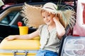 beautiful travelling girl sitting in car trunk Royalty Free Stock Photo
