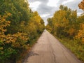 Beautiful tree-lined foot and bike path in autumn in Assiniboine Forest in Winnipeg, Manitoba, Canada Royalty Free Stock Photo