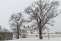 Beautiful trees in front of the gates of the Orthodox monastery Royalty Free Stock Photo