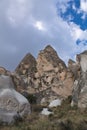 Beautiful troglodytes in rose valley in blue sky with clouds Royalty Free Stock Photo