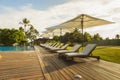 Beautiful tropical beach front hotel resort with swimming pool, Royalty Free Stock Photo