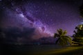 Amazing nature landscape. Night beach sky with palm trees and storm clouds. Night shot with palm trees and milky way in background Royalty Free Stock Photo