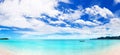 Beautiful tropical beach panorama, exotic island lagoon, boat on turquoise sea water, ocean waves, yellow sand, blue sky sun cloud Royalty Free Stock Photo