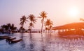 Beautiful tropical beach restaurant with palm trees. Sunrises and sunsets. Royalty Free Stock Photo