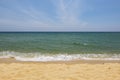 Beautiful tropical beach, soft wave hitting sandy beach under bright sunny day Royalty Free Stock Photo