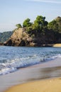 Beautiful tropical beach, soft wave hitting sandy beach under brighter sunny day Royalty Free Stock Photo