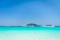 Beautiful tropical beach, white sand and blue sky background wit