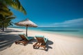 beautiful tropical beach with white sand and two sunbeds framed with palms. Bright crystal clear see. tropical vacation Royalty Free Stock Photo