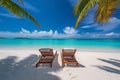 beautiful tropical beach with white sand and two sunbeds framed with palms. Bright crystal clear see. tropical vacation Royalty Free Stock Photo