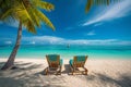 beautiful tropical beach with white sand and two sunbeds framed with palms. Bright crystal clear see. tropical vacation Royalty Free Stock Photo