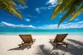 beautiful tropical beach with white sand and two sunbeds framed with palms. Bright crystal clear see. tropical vacation Royalty Free Stock Photo