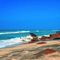 Beautiful tropical coast with big stones and black sand of the I Royalty Free Stock Photo