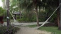 Beautiful tropical garden with hammock on site Resort Intime Sanya 5 stock footage video