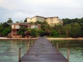 Beautiful tropical hotel with pier near the beach Royalty Free Stock Photo